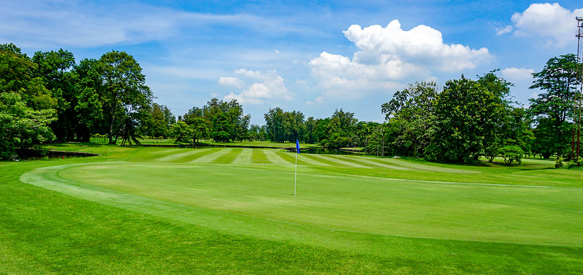 Ekachai-Golf-and-Country-Club-green-grass-and-blue-skies.jpg