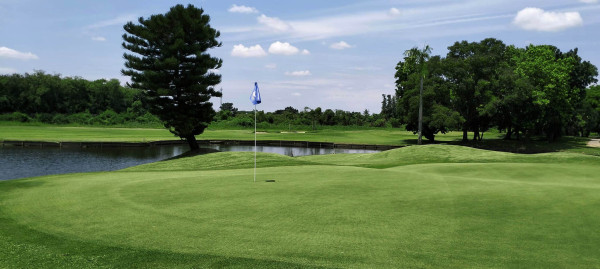 Ekachai-course-view-blue-sky-green-water-hazard.jpg